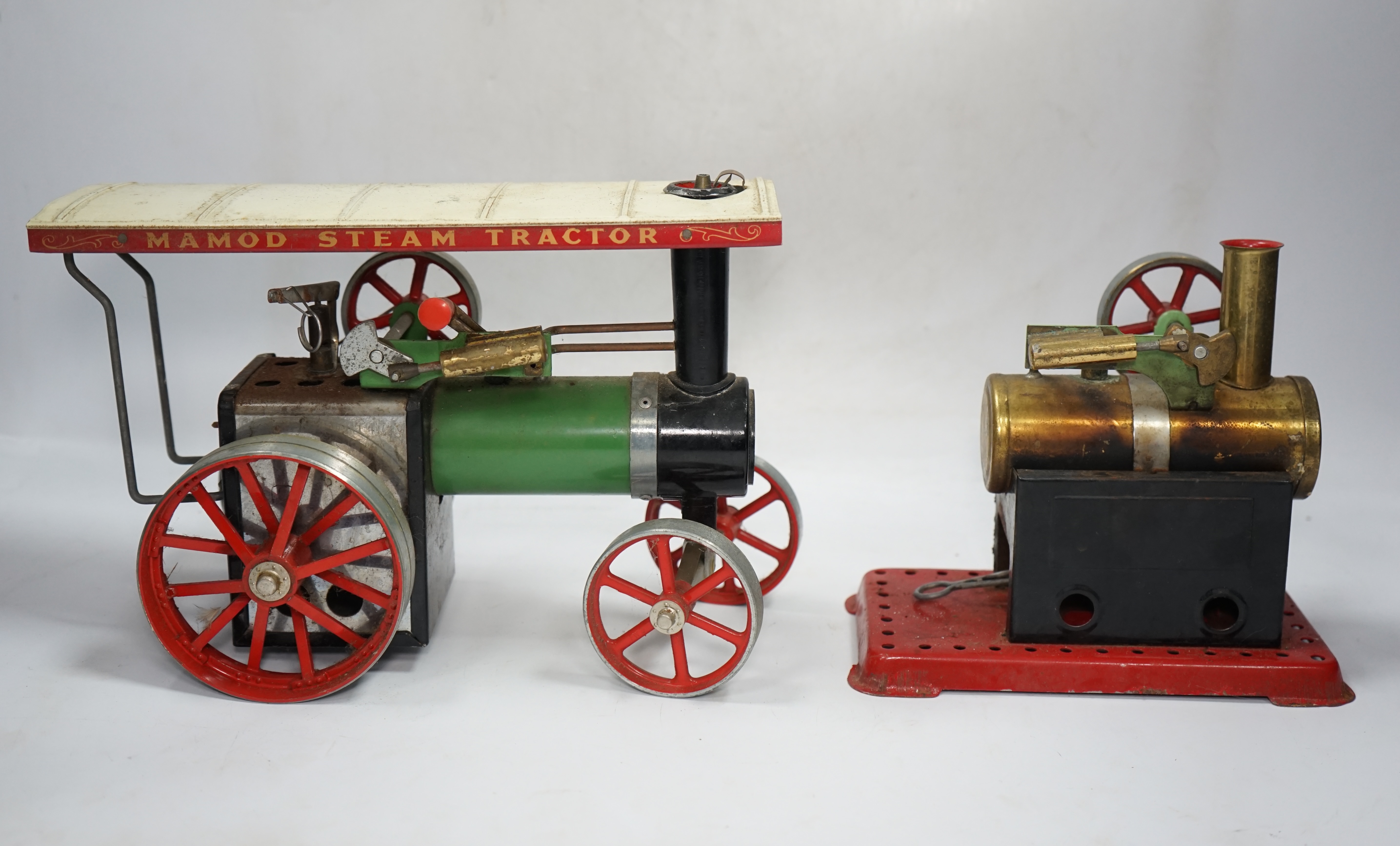 A Mamod live steam traction engine and a single cylinder stationary engine. Condition - poor to fair.